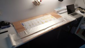 Use of thin roll of plastic to cover plans